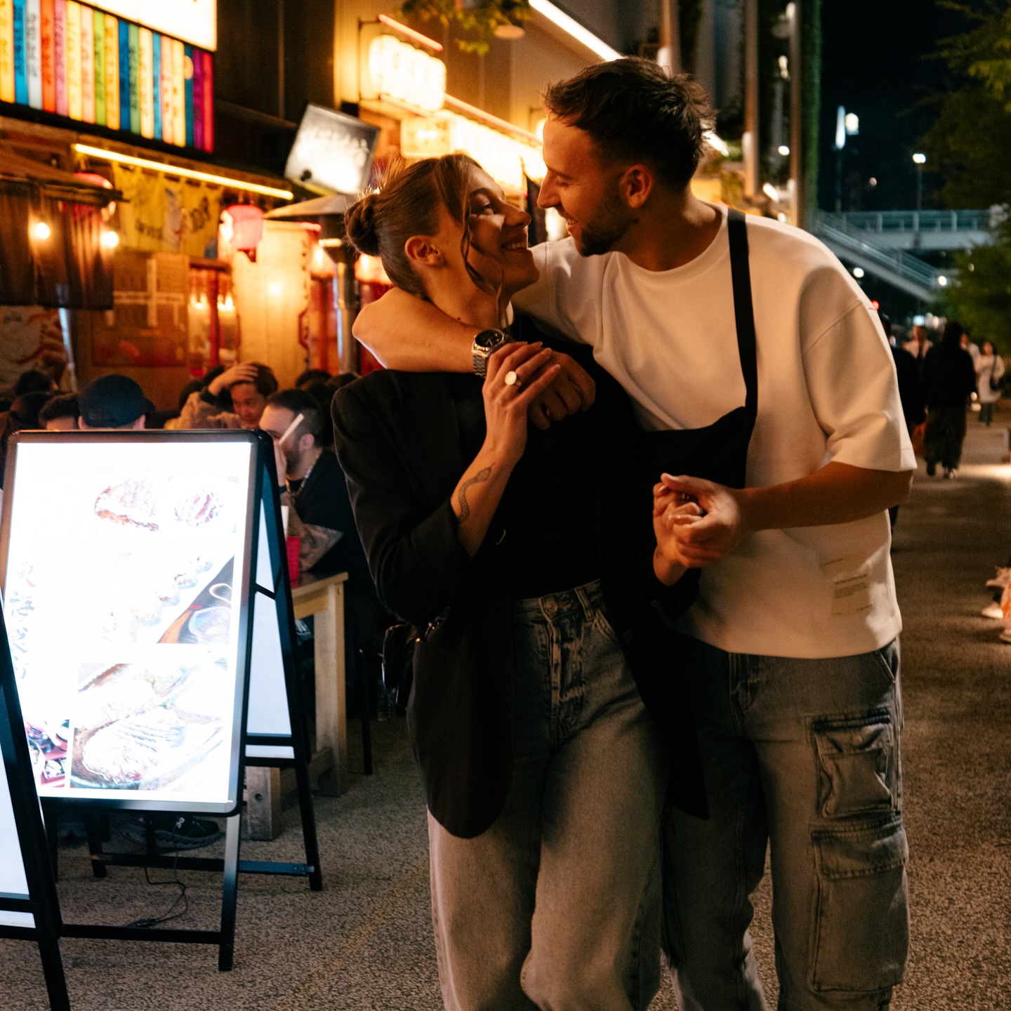 A couple photographed in Tokyo at night